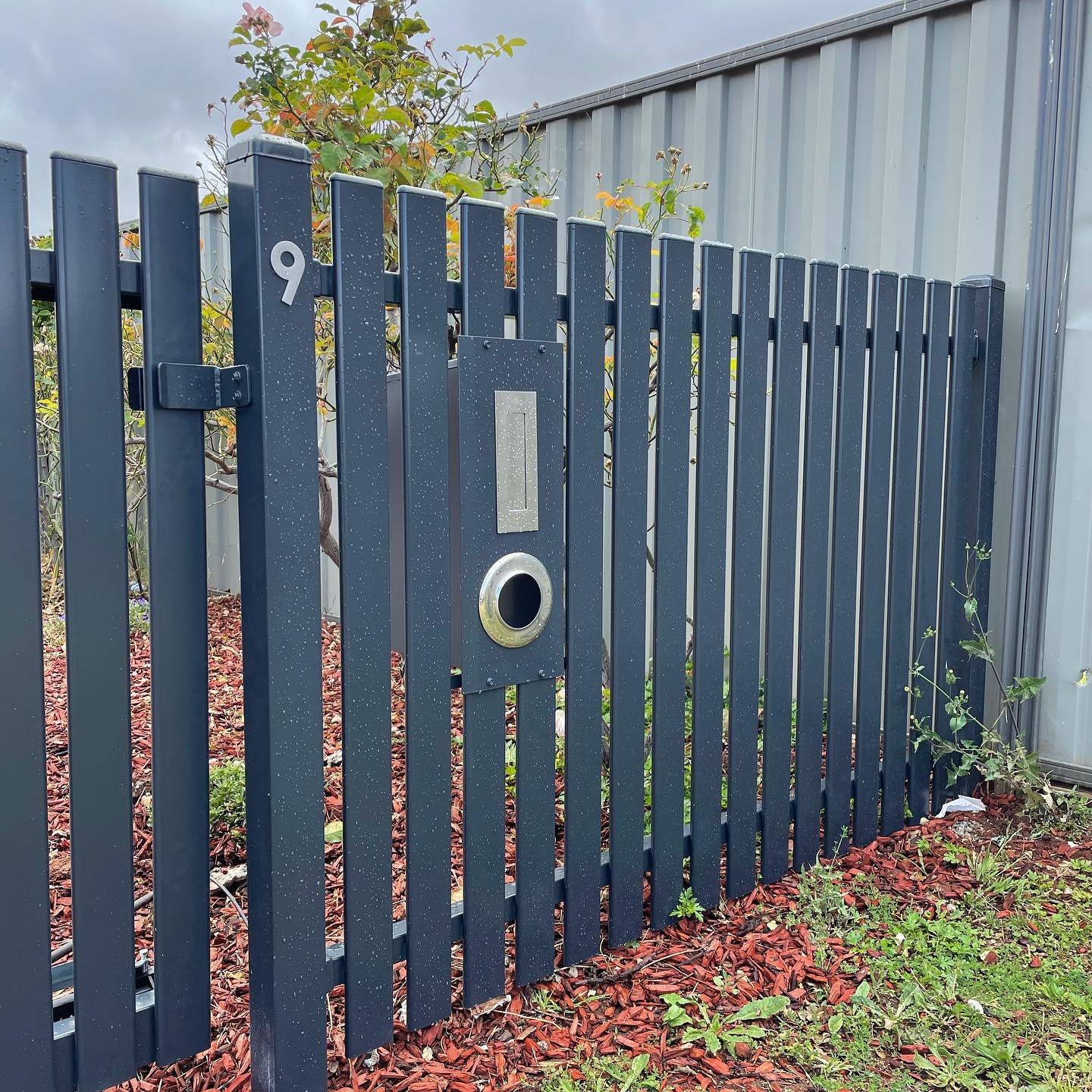 Charcoal Satin Steel Picket Fence in Melton South: A Client-Approved Success Story 5 Gate with latch mechanism