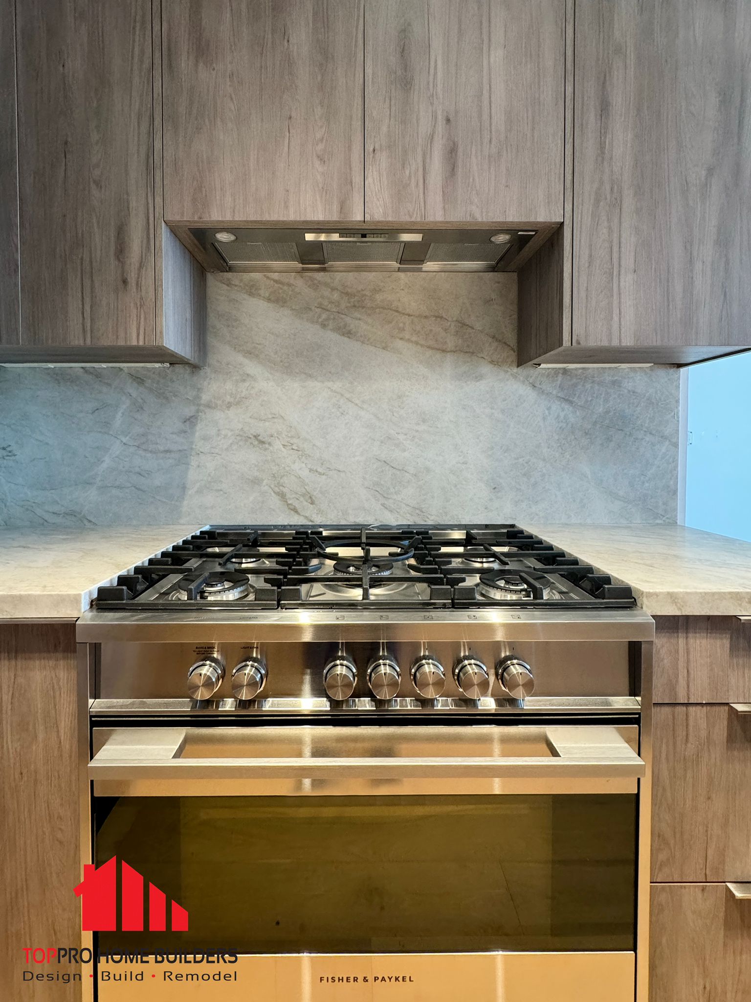 Stainless steel gas stove with wooden cabinetry