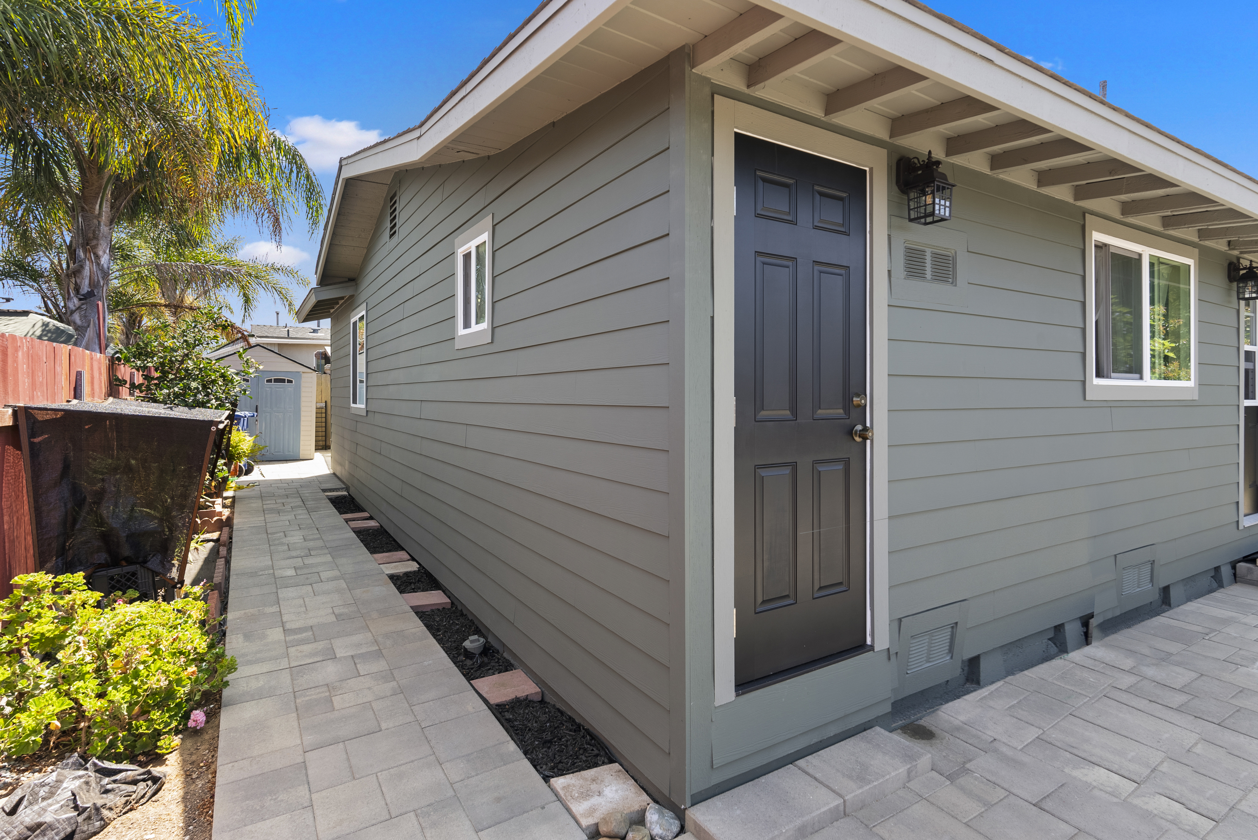 Exterior siding painted in muted green color