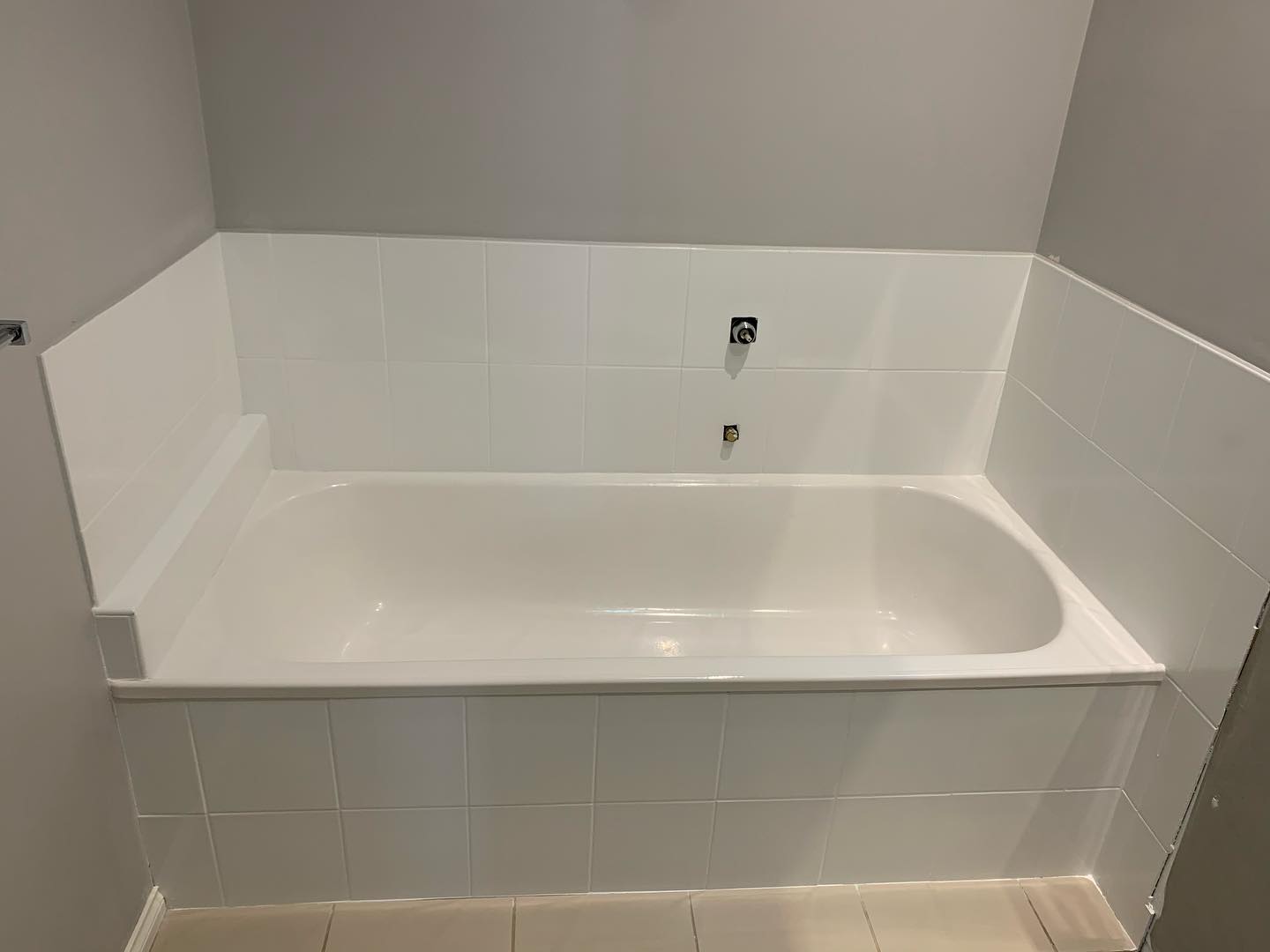 White bathtub with glossy finish after resurfacing