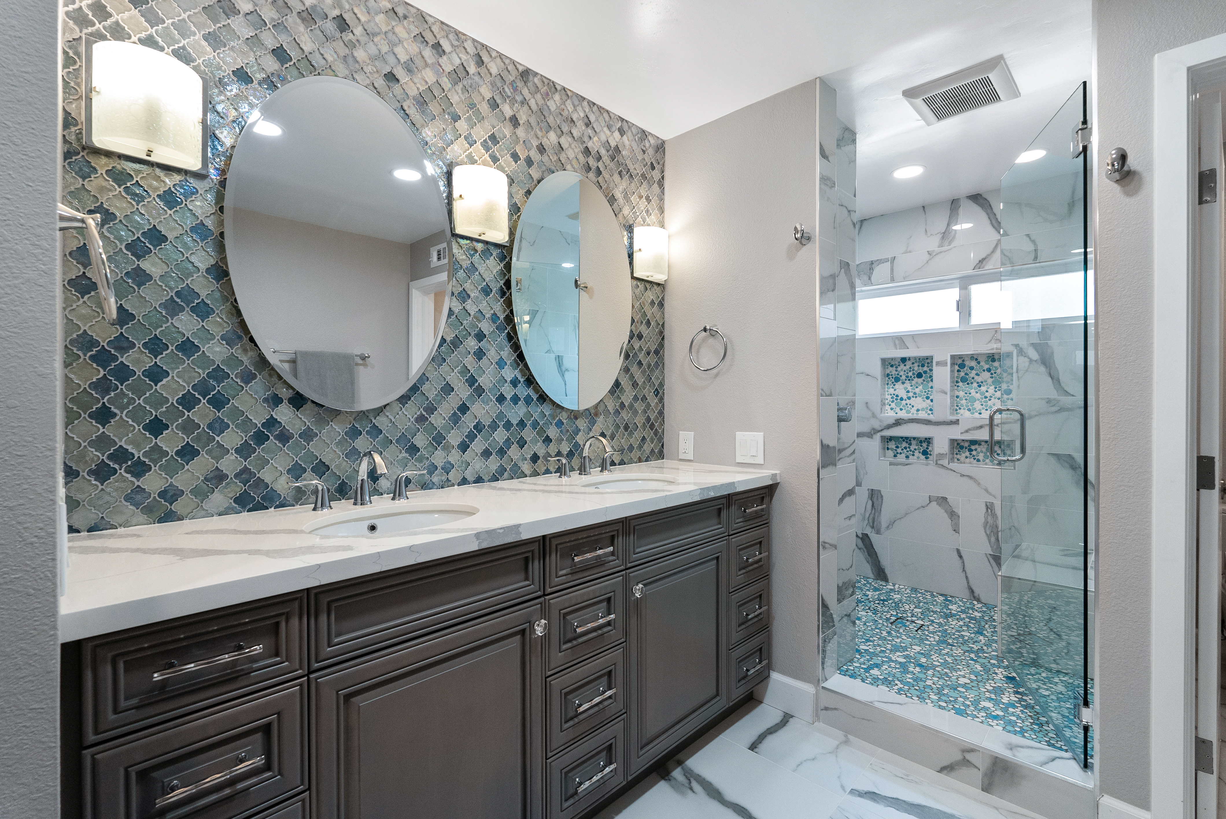 Double sink vanity with dark wood cabinets