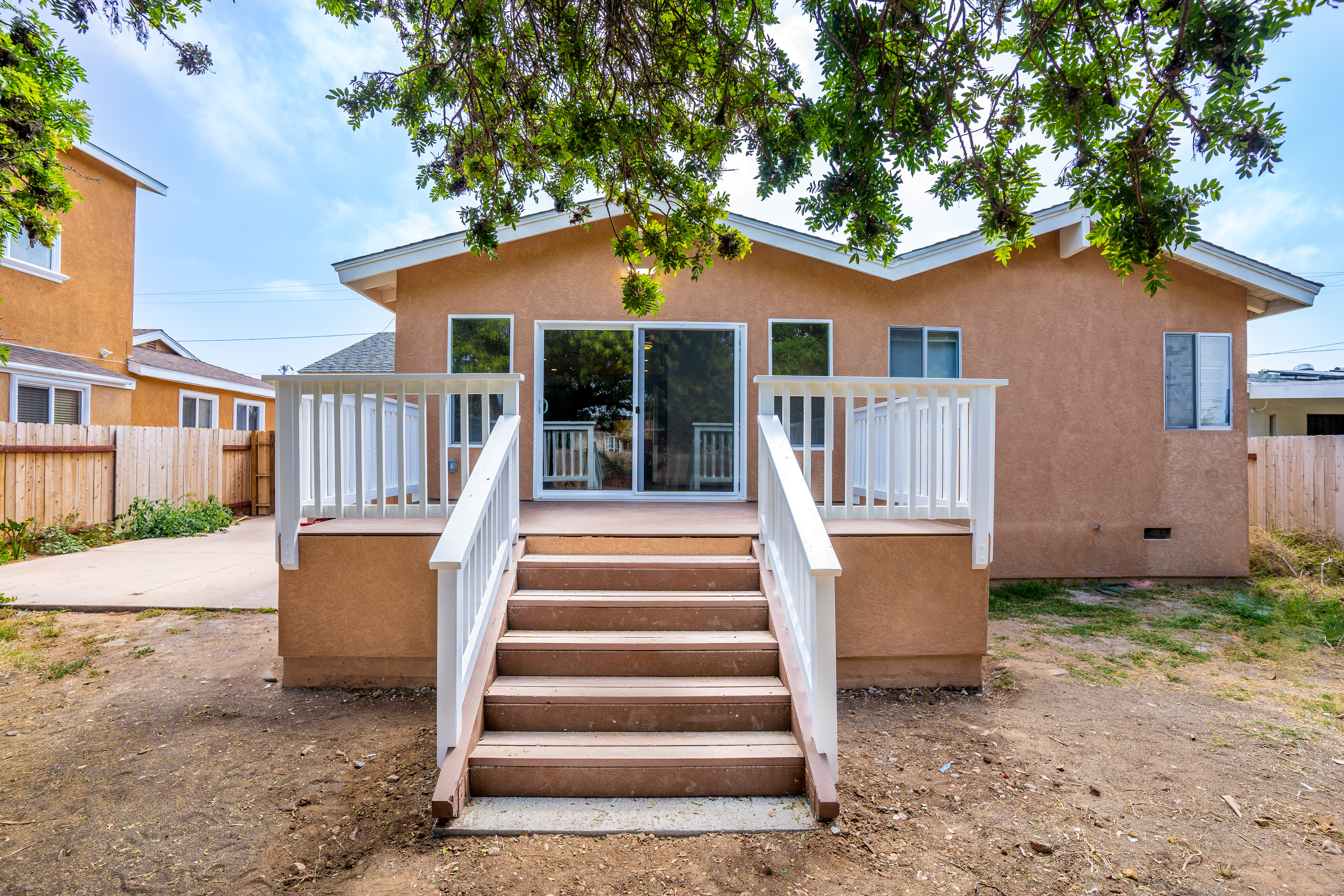 Single-story residential structure with beige stucco exterior