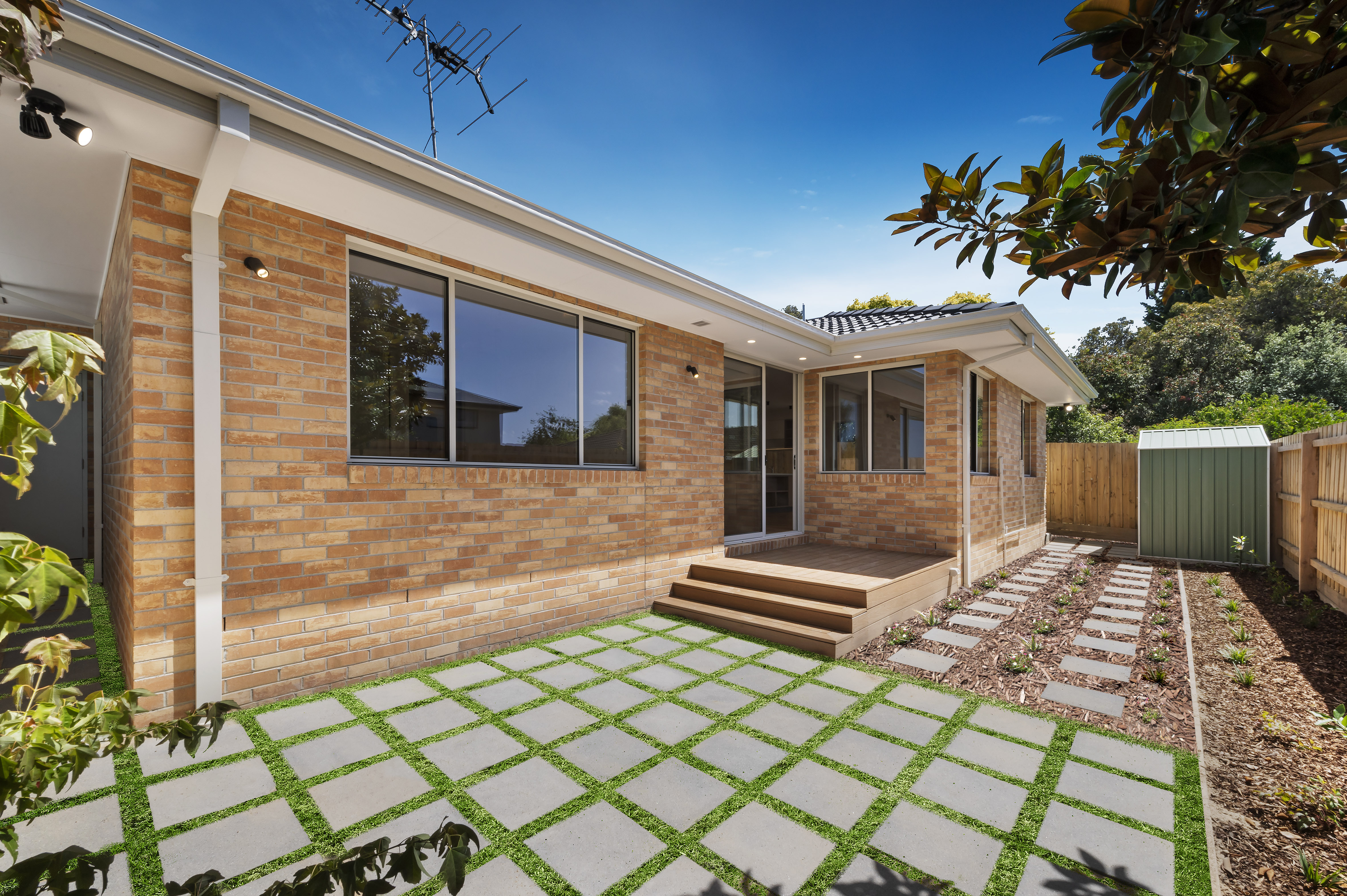 Outdoor deck area leading to garden