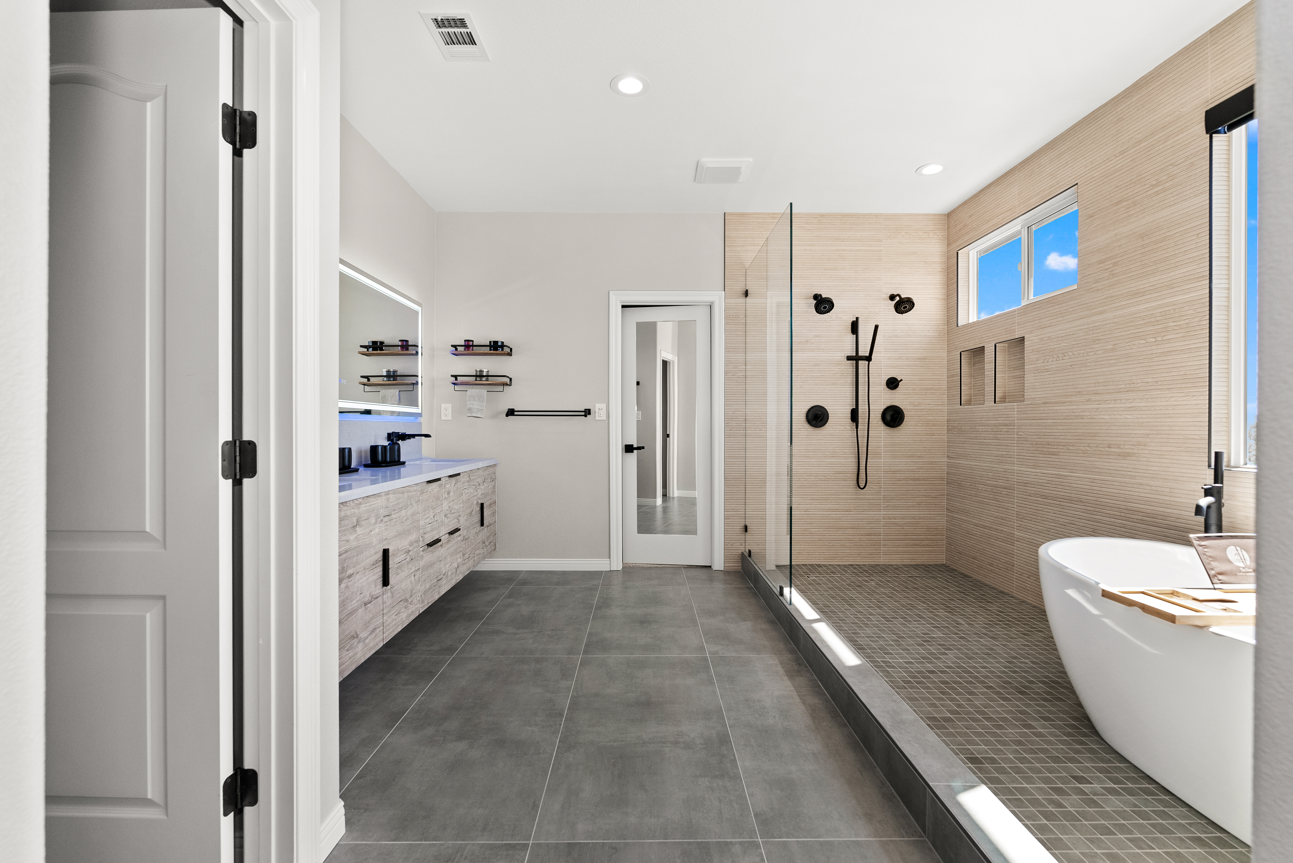 Modern bathroom with walk-in shower and freestanding tub