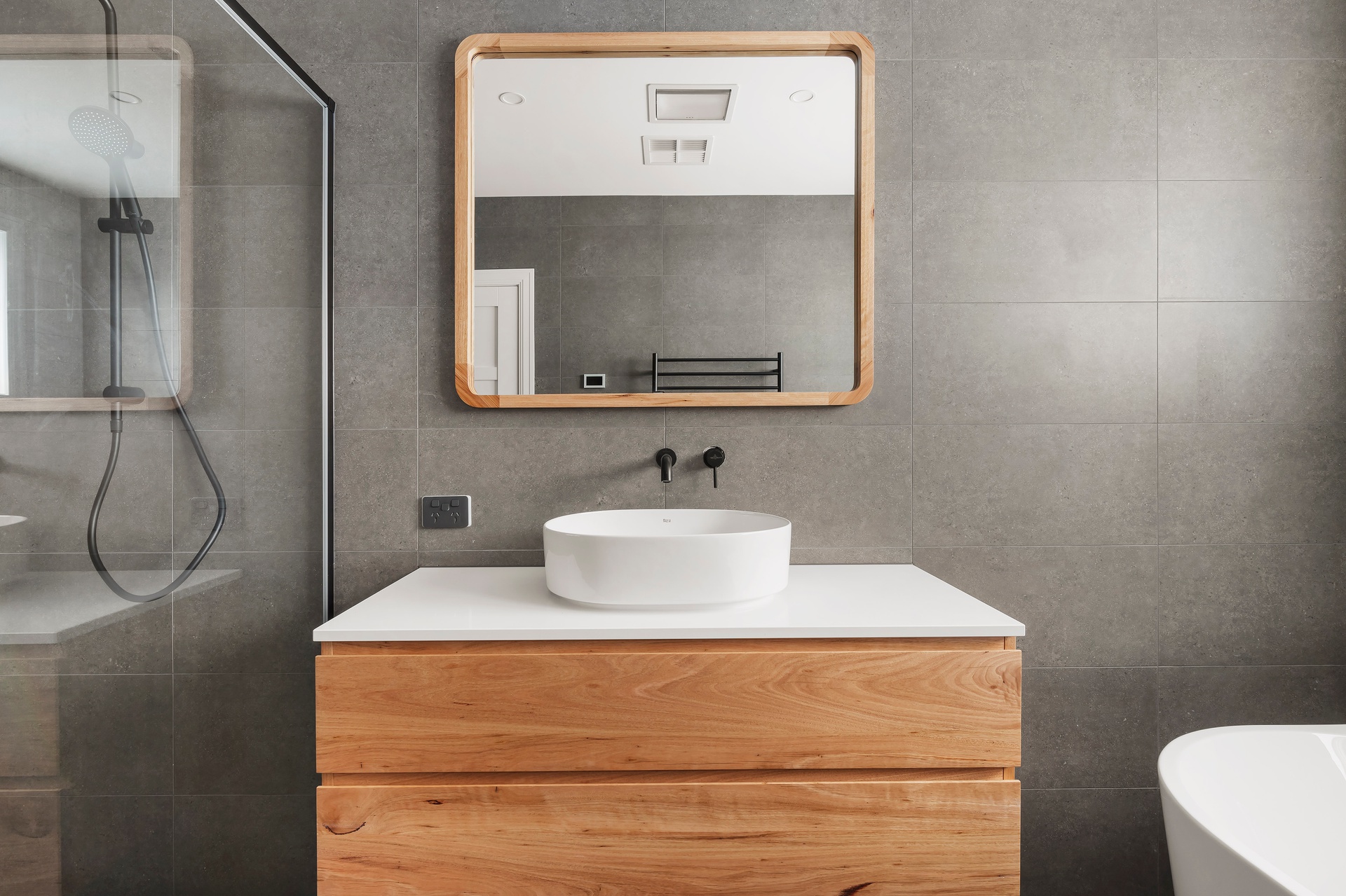 Wooden vanity in modern bathroom