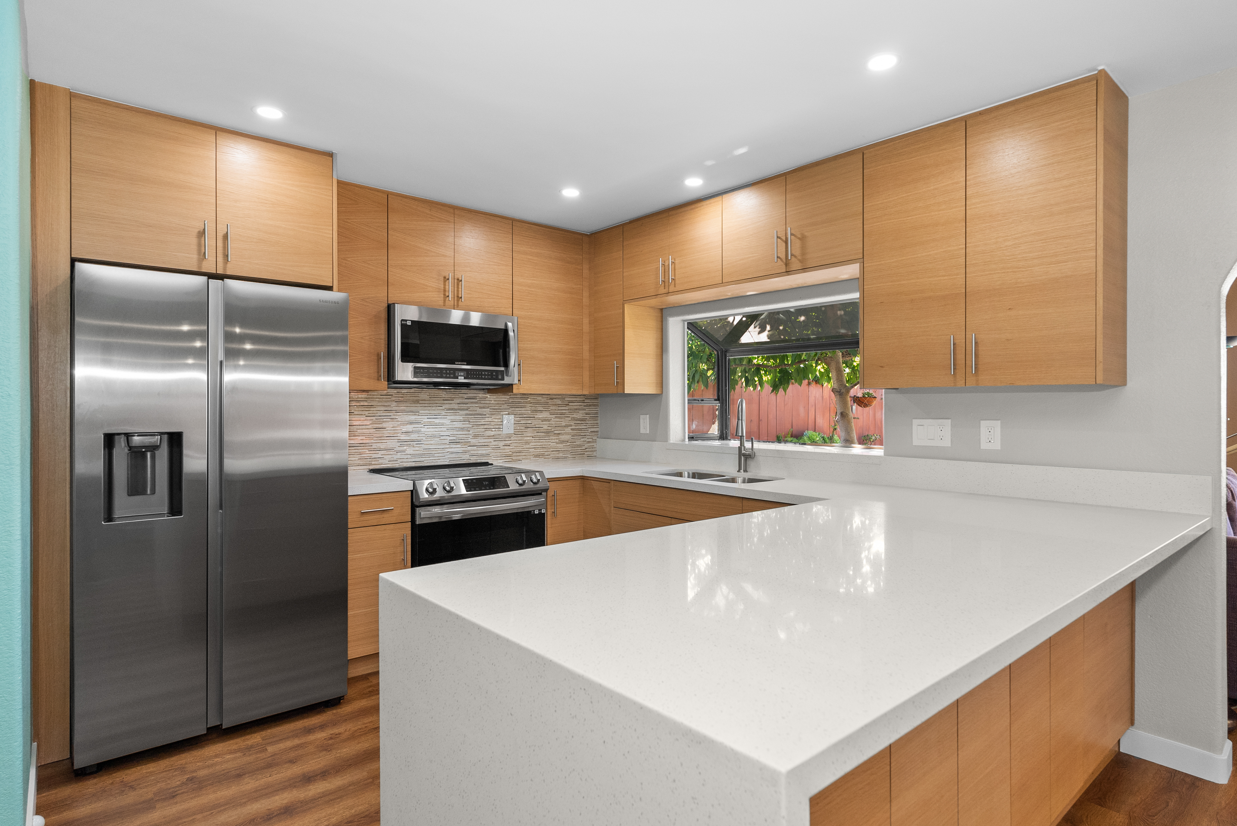 Kitchen featuring wooden cabinetry and stainless steel appliances