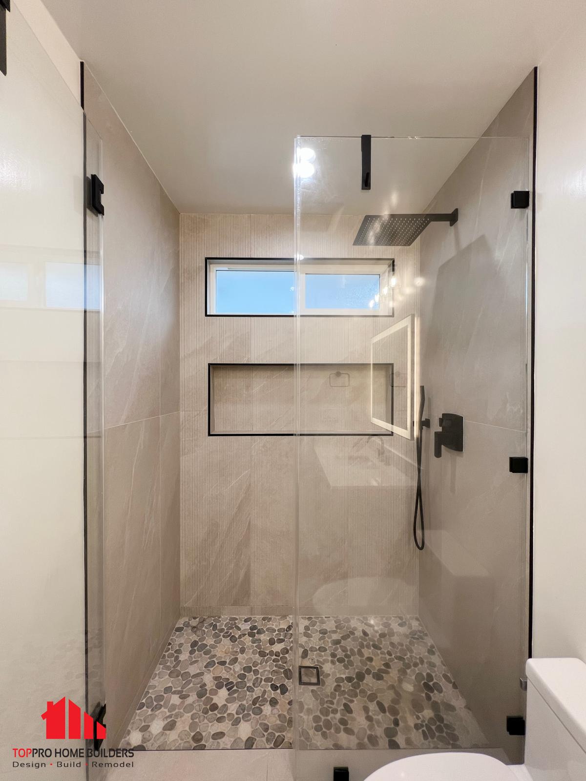 Modern bathroom shower area with glass enclosure