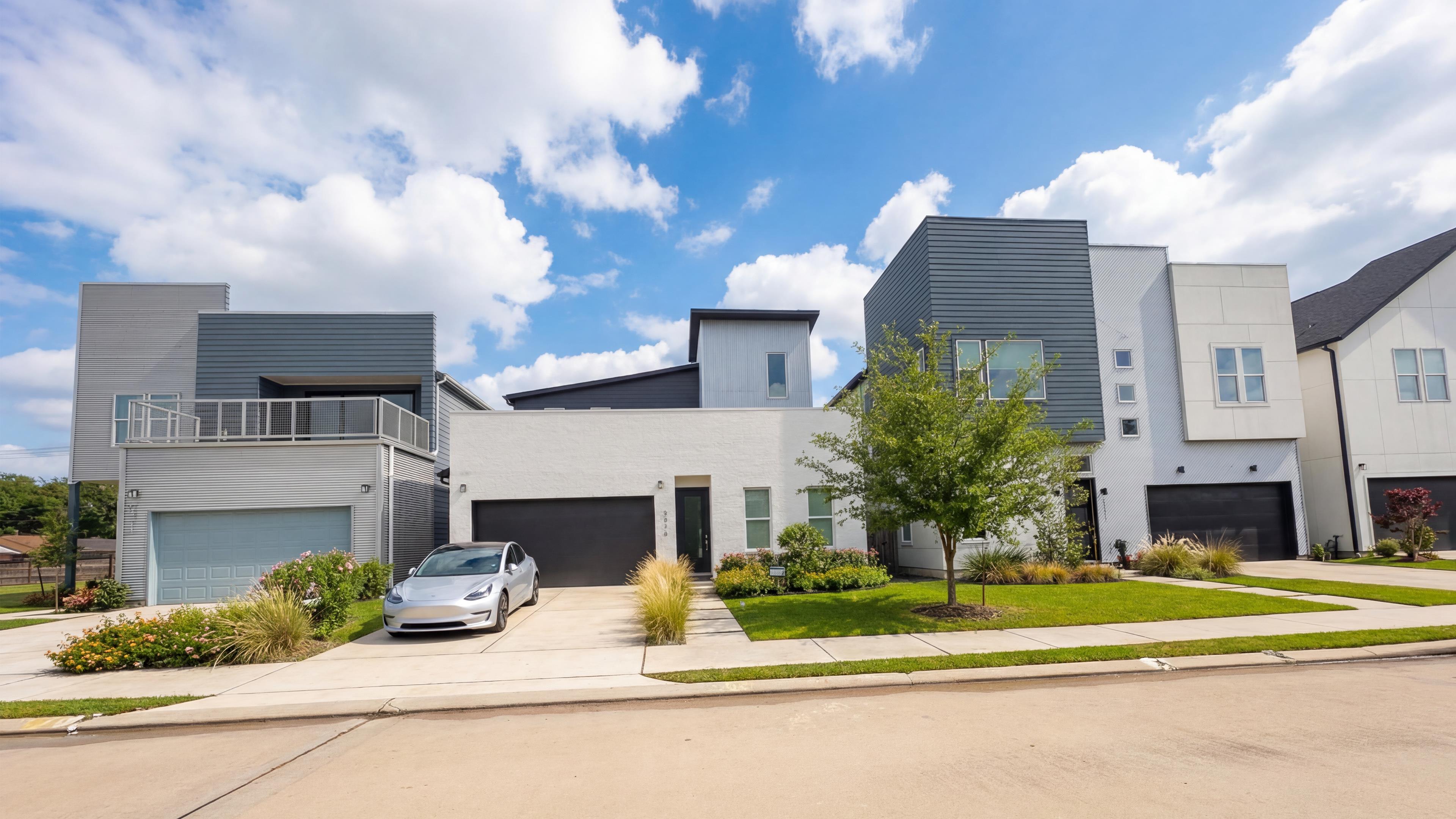 Avondale street view with modern homes and attached garages