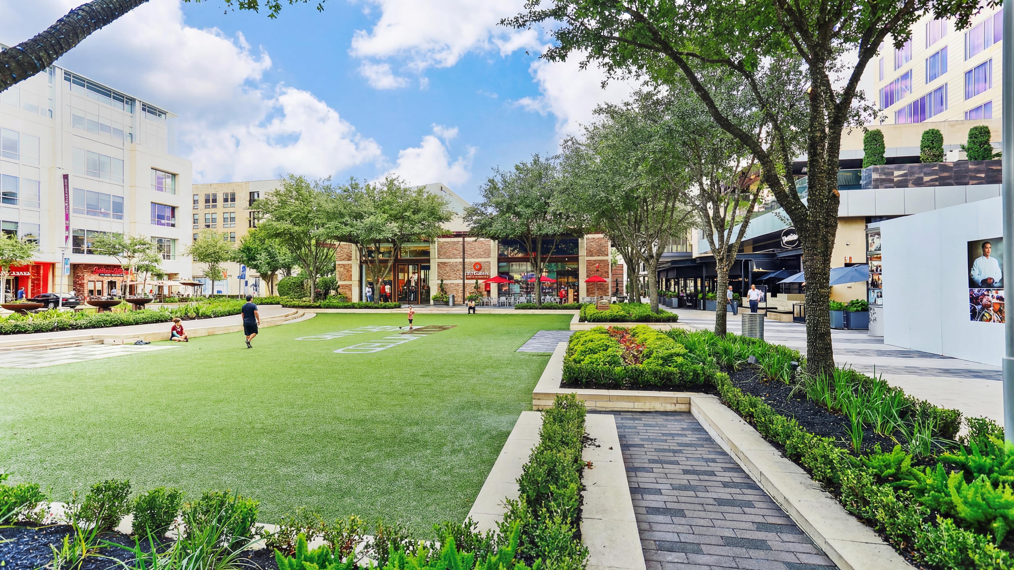 Walkable Urban Plaza with Green Space, Shops, and Dining Nearby