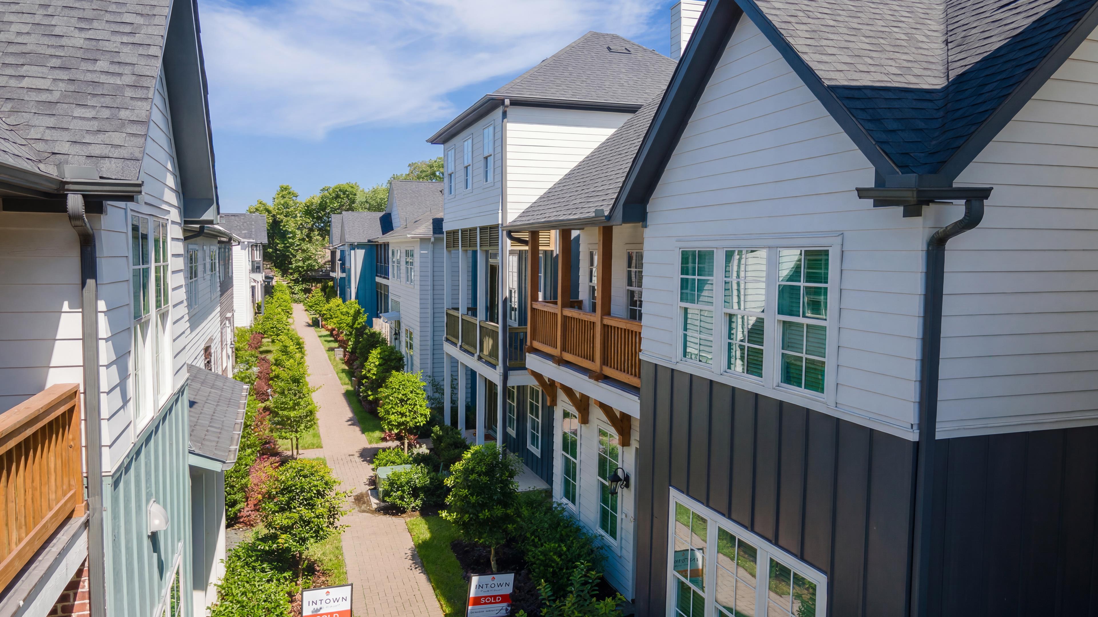 Eastwood Green Homes with Landscaped Walkways and Charming Balconies
