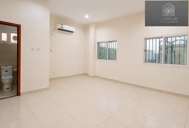 Family 2-Bedroom Apartment with Majlis in Madinat Khalifa Building 58