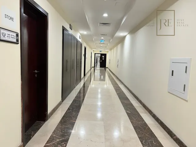 Semi-Fitted Shop Space for Rent in Al Mamoura Plaza | Prime Location + Parking - view 3