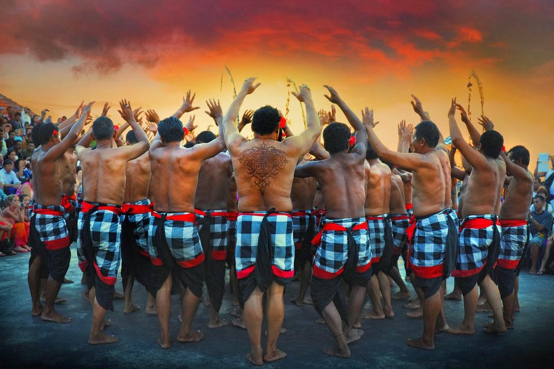 Balinese Kecak dancers performing a traditional fire dance.