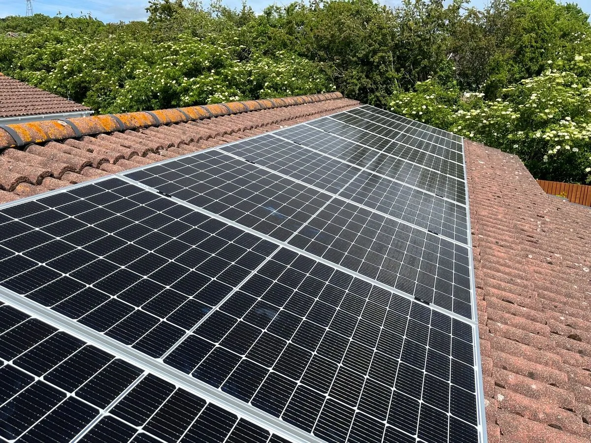 Professional solar panel installation on residential roof