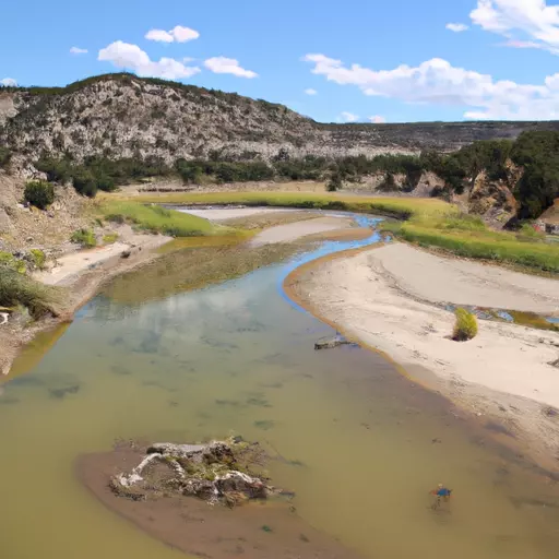 A picture of a river flowing through a desert