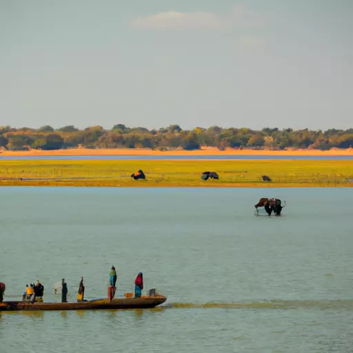 A photo of people on boats sailing down a river in Africa, with animals visible in the background