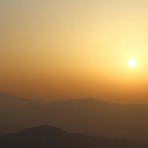 A picture of a sunrise over a mountain in Japan