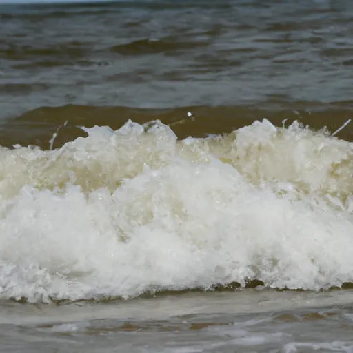 A picture of ocean waves crashing on a beach