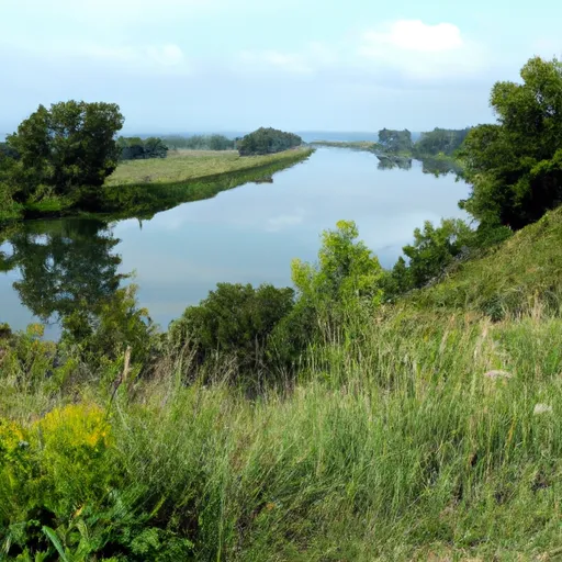 A picture of a river winding through a lush green landscape