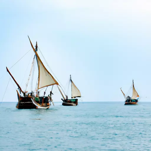 A picture of three old looking boats sailing on the sea