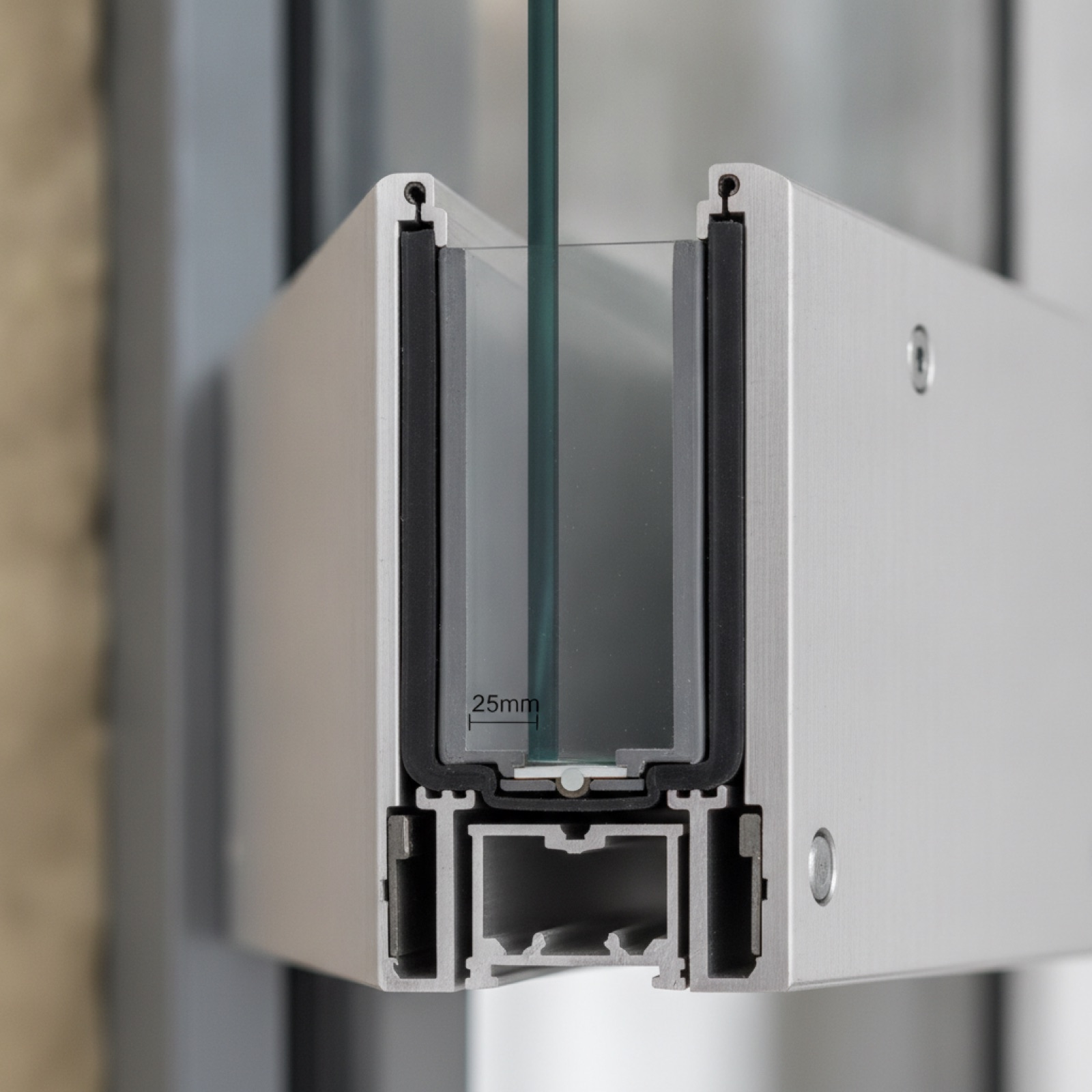 Mullion detail showing glass bite engagement and sealant retention in curtain wall frame