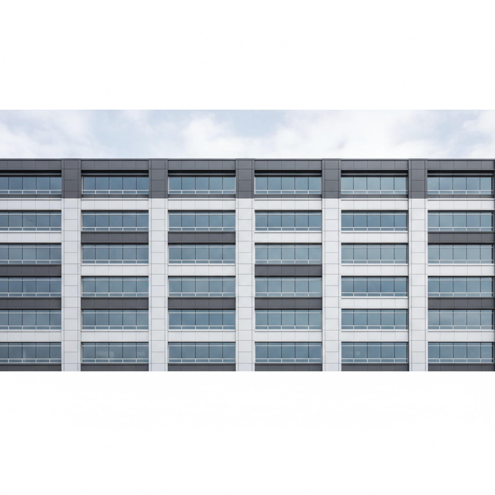 Commercial facade integrating spandrel glass and ACM panels in coordinated design