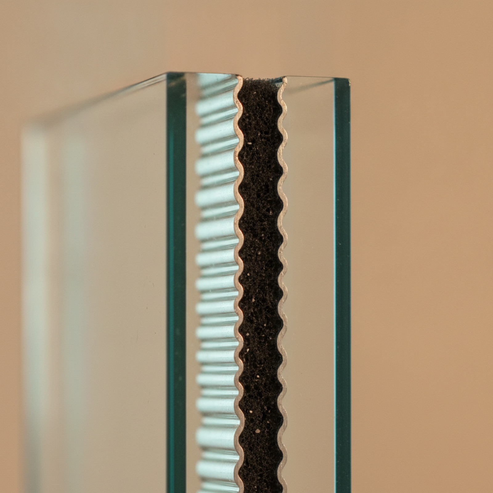IGU edge detail showing spacer, gas fill, and Low-E coating layers