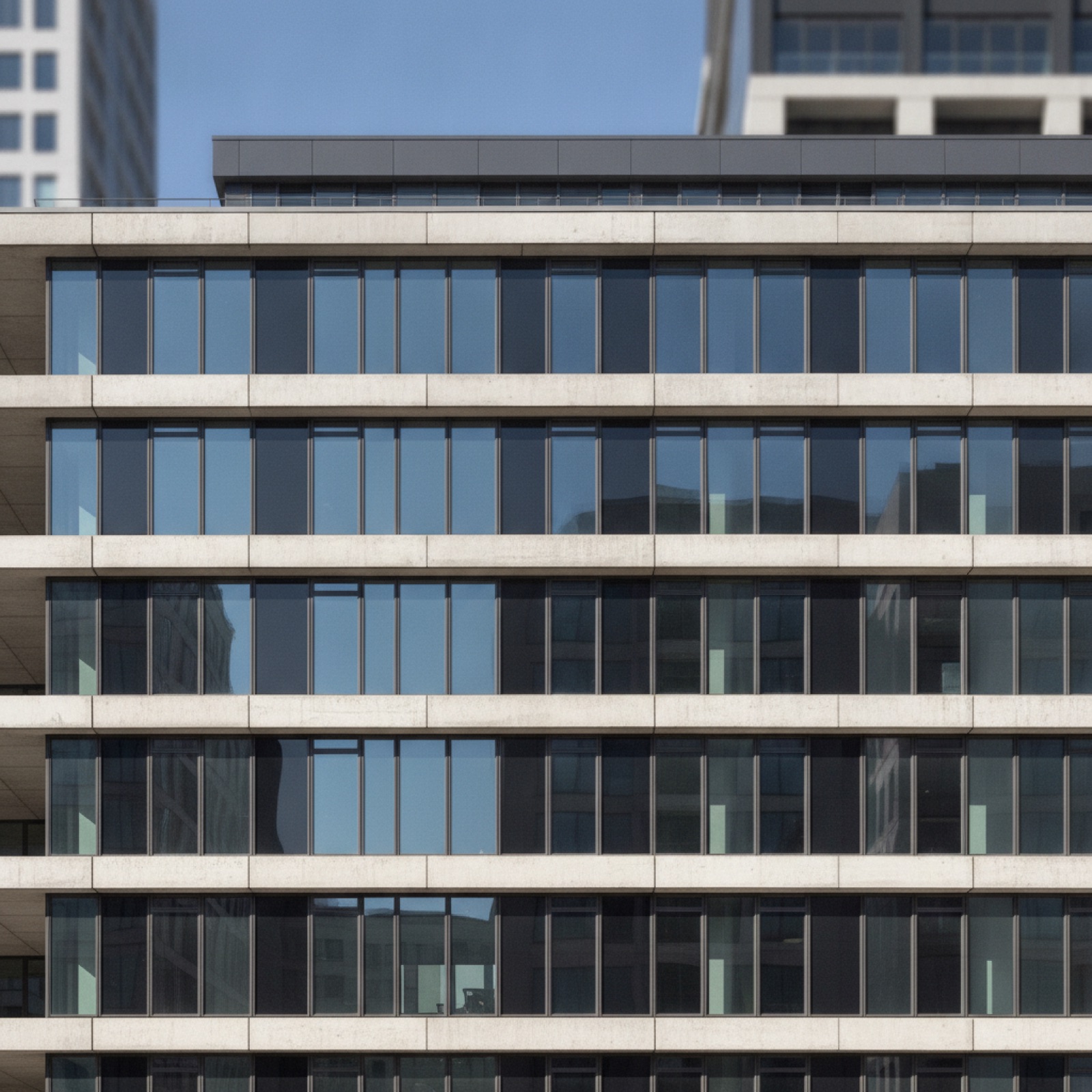Mid-rise building facade showing window wall configuration with expressed floor slab edges