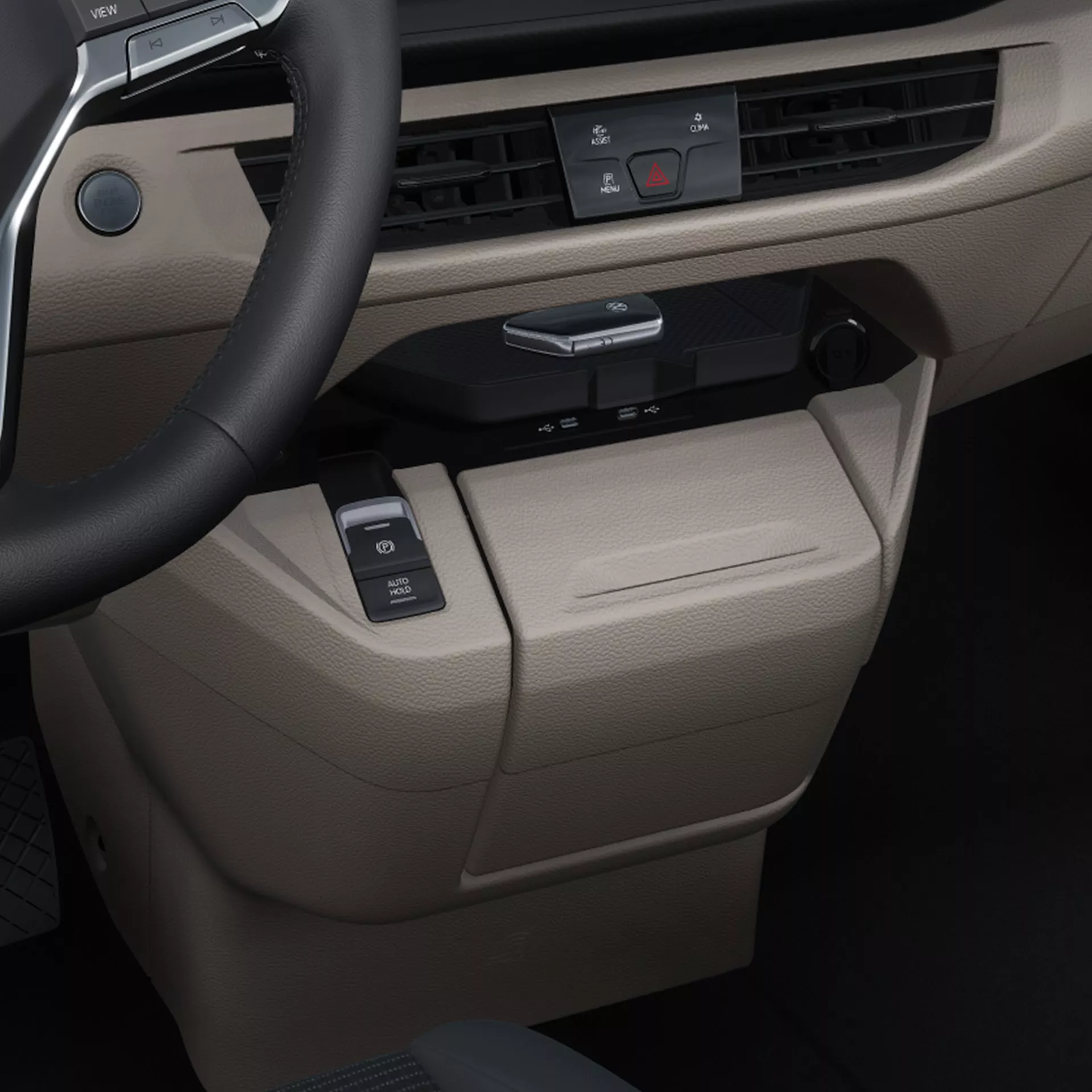 Dettaglio degli interni di un veicolo con volante e cruscotto.