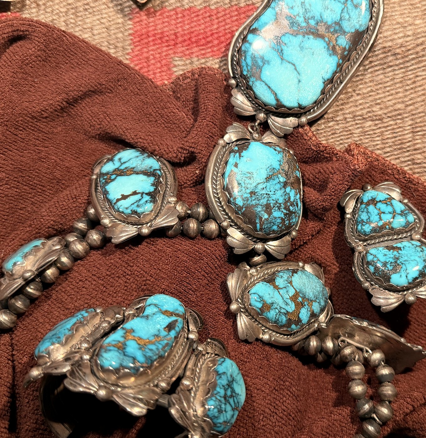 A silver necklace, bracelet and ring set with large turquoise nuggets
