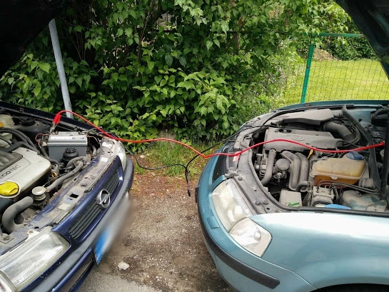 How to jump start a car with cables?