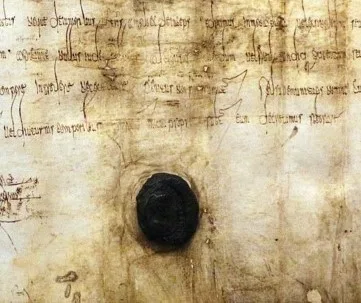 Historical manuscript with a large dark wax seal covering part of the page