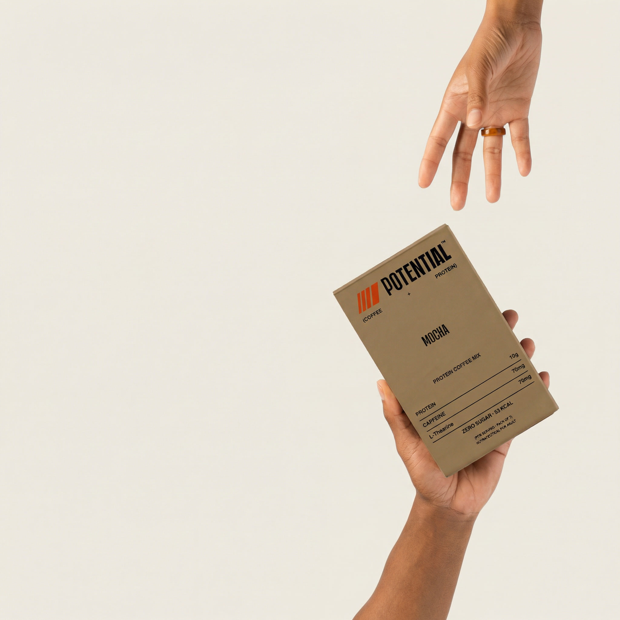 gemini-image-2_Recreate_this_image_with_the_hands_but_replace_the_AG1_bottle_with_Potential_box-0.jpg