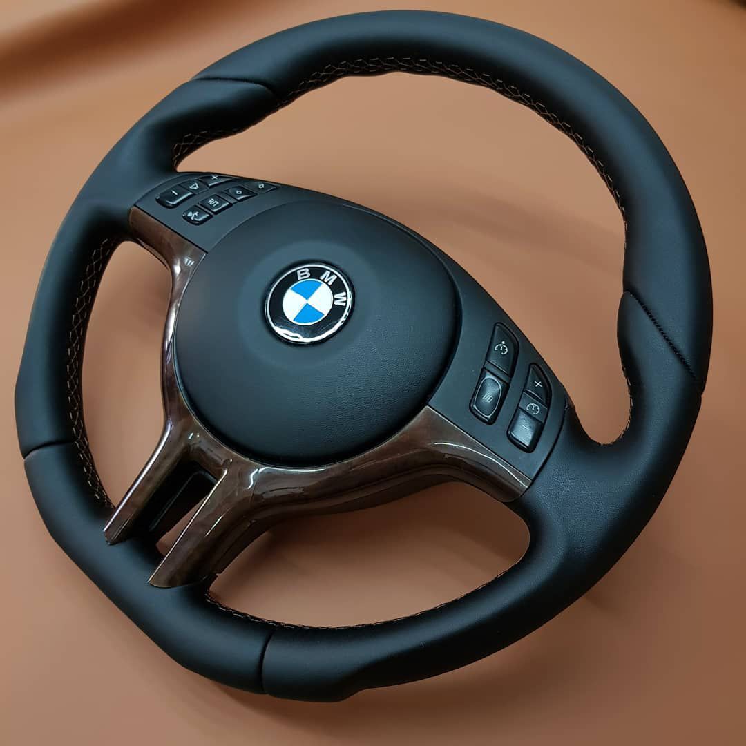 Restored black leather steering wheel