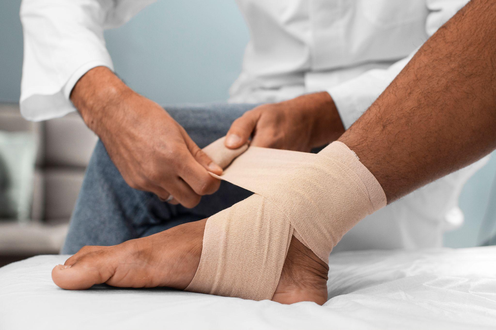 A doctor wrapping a bandage for a patient.