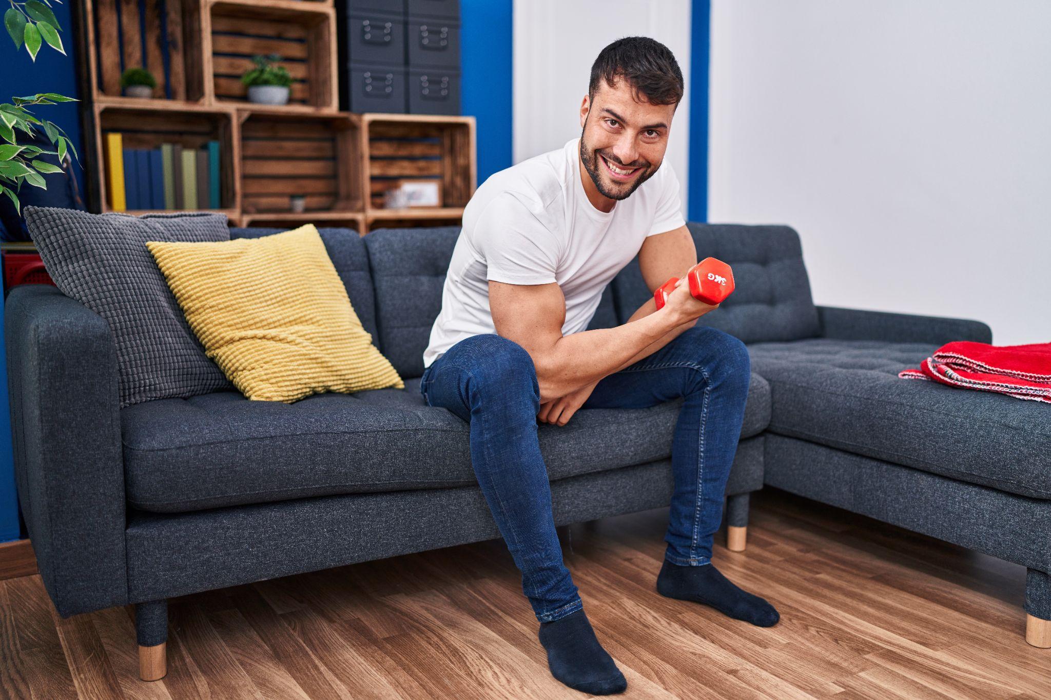 A man working out with dumbbells.