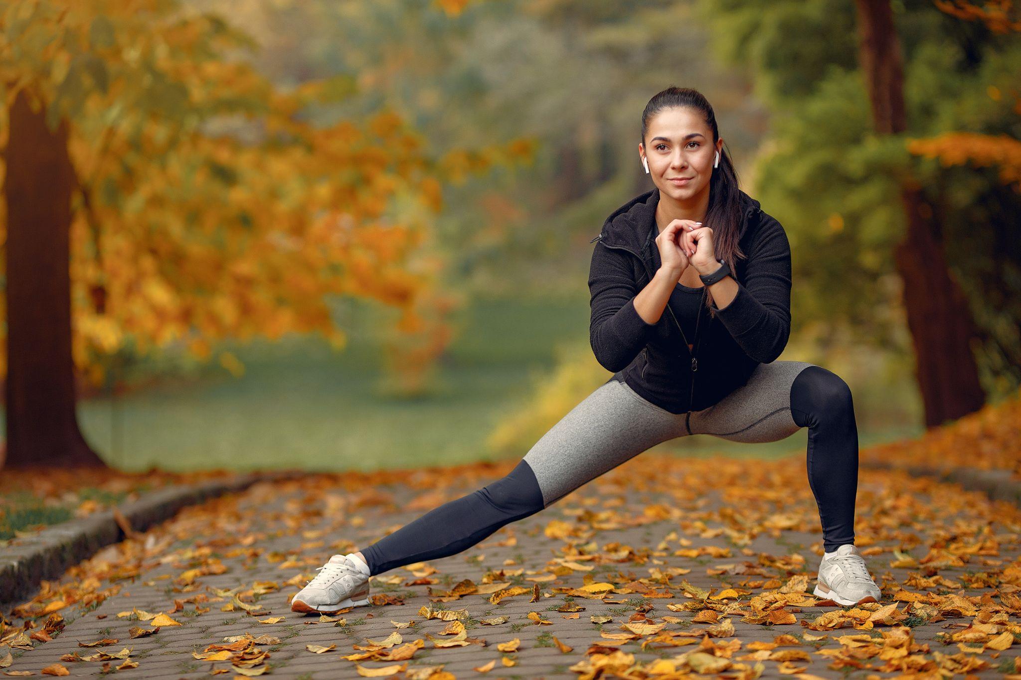 A woman working out in a garden.