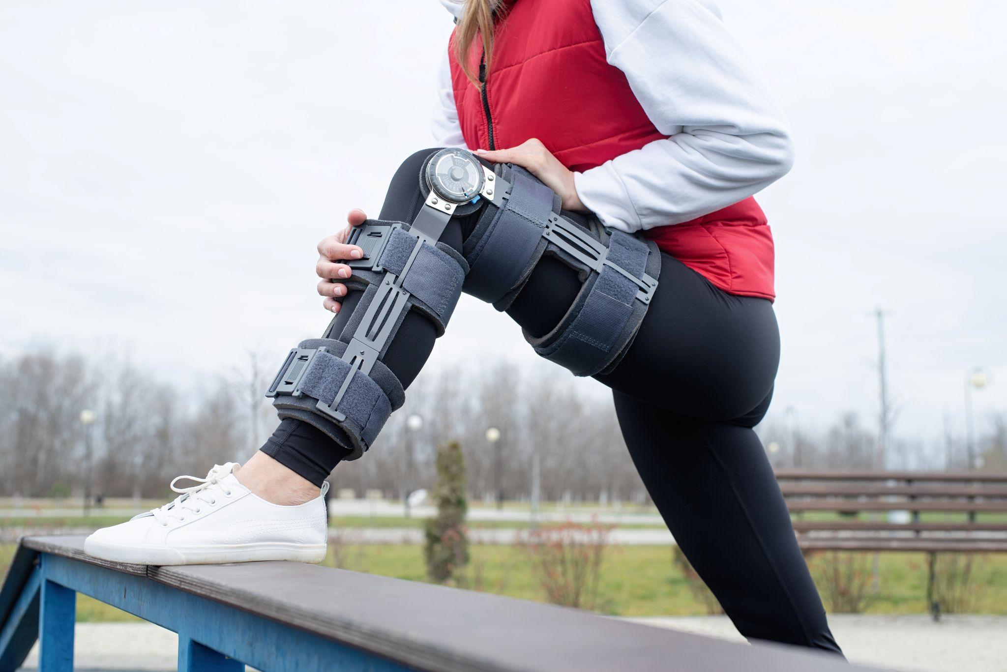 A woman working out with robotic-assisted supporting equipment.