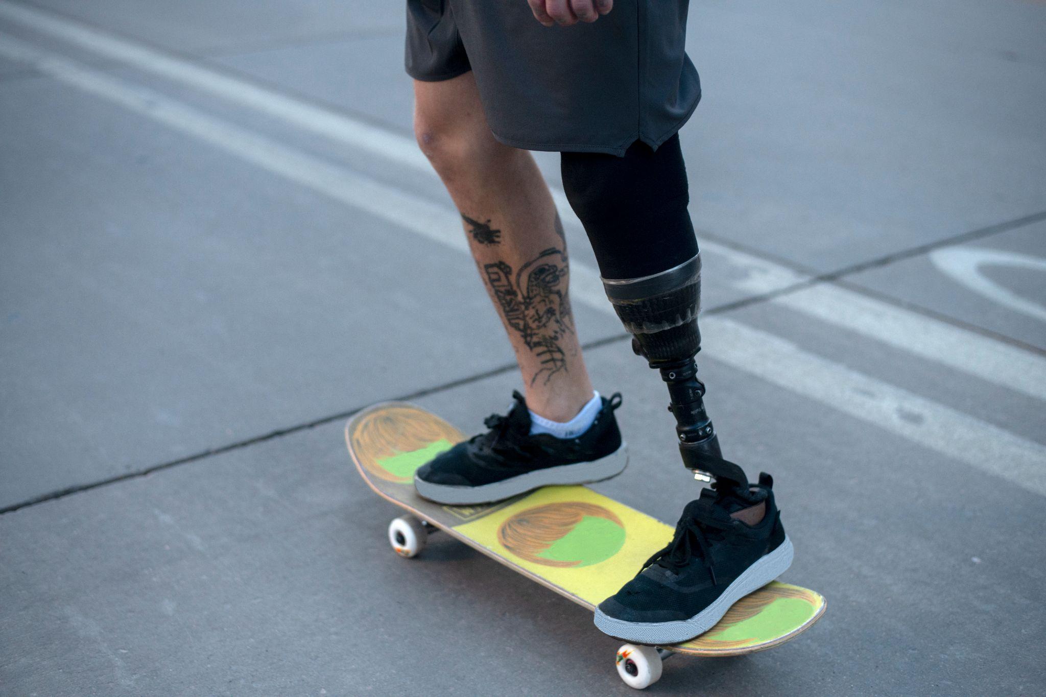 A man skating with the help of robotic-assisted supporting equipment.