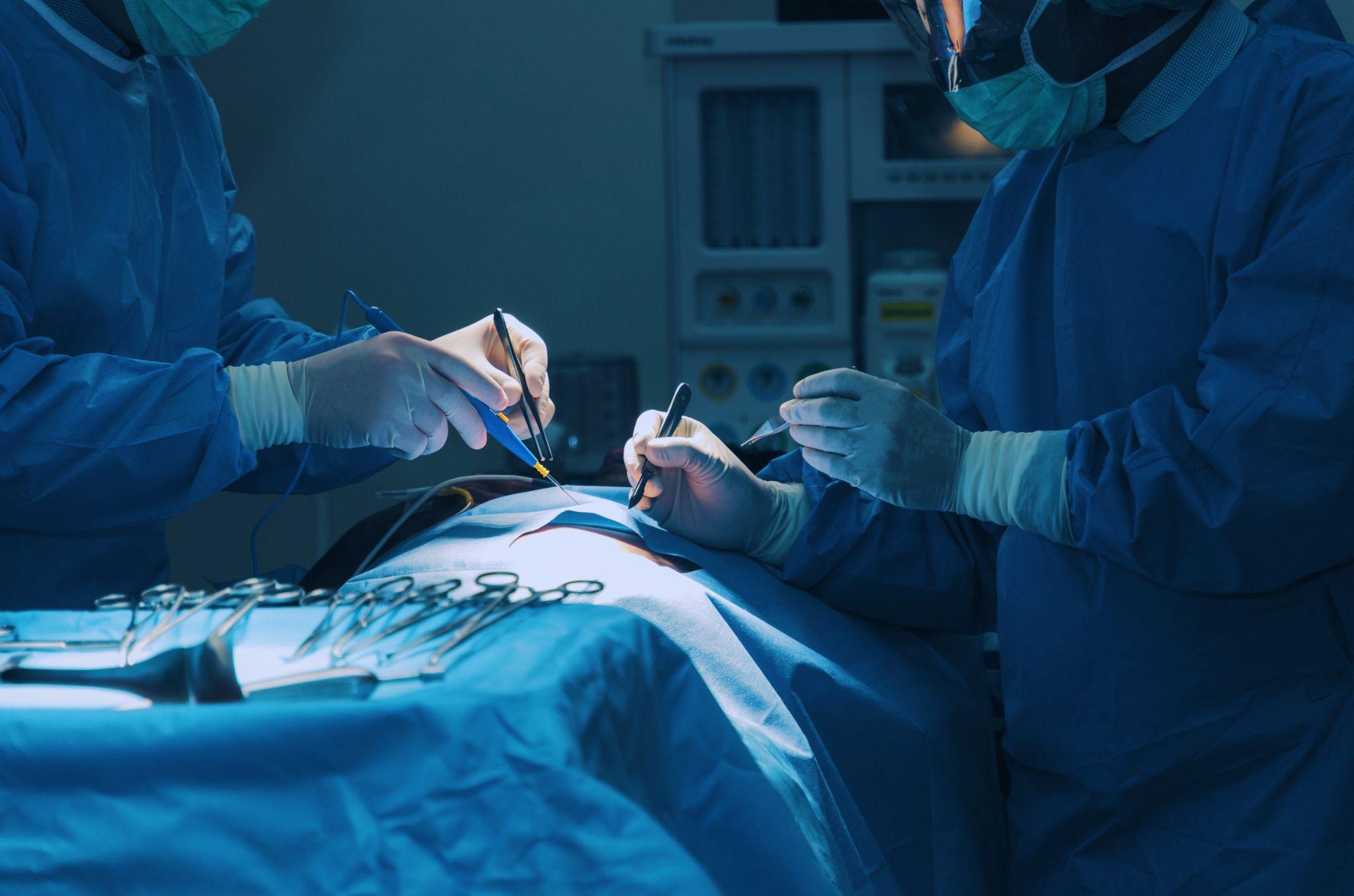 Two doctors performing surgery.