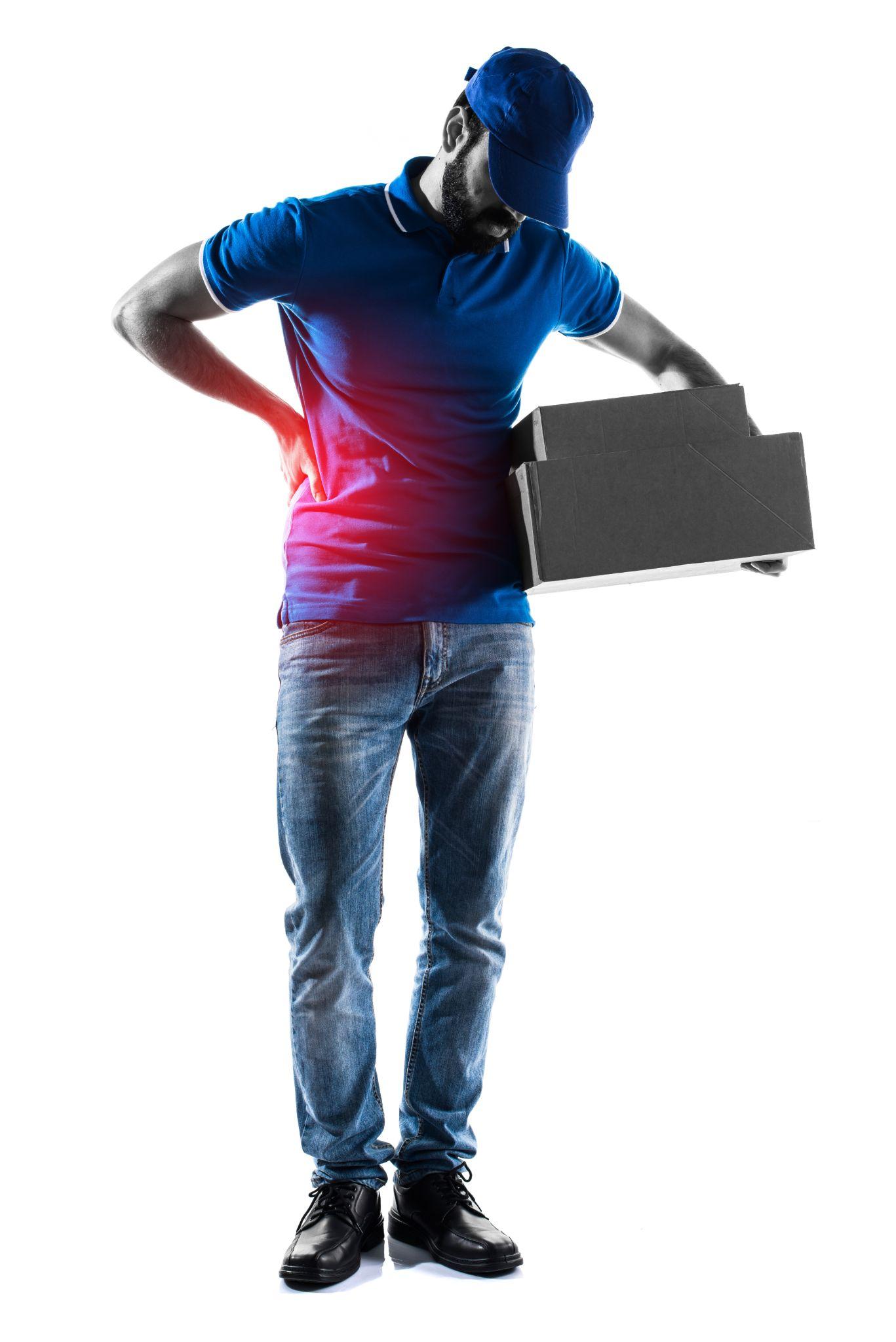A delivery worker bends slightly while holding packages, with a red-highlighted area on his lower back indicating strain or injury. The image emphasizes improper lifting technique or work-related back stress.