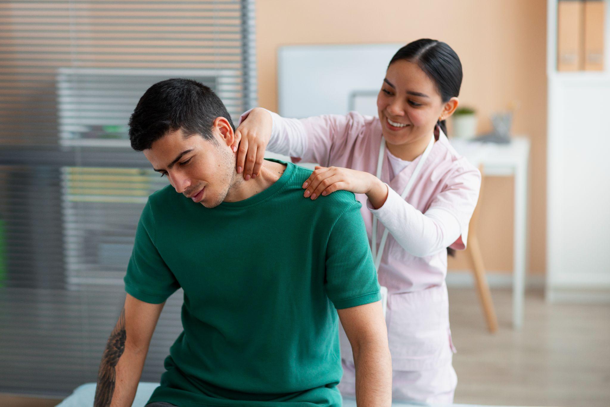 A healthcare professional providing guided physiotherapy to a patient.