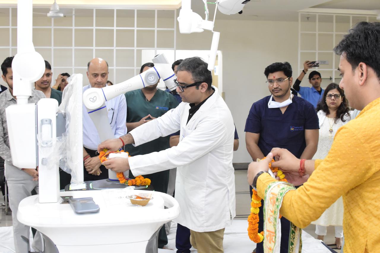 Dr. Ankur Singh with a new orthopedic machine at the clinic, highlighting the use of advanced technology for precise diagnosis and treatment.
