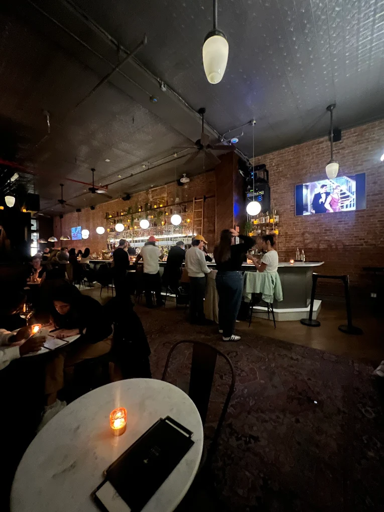 stylish bar and restaurant with dim lighting in tribeca Little More