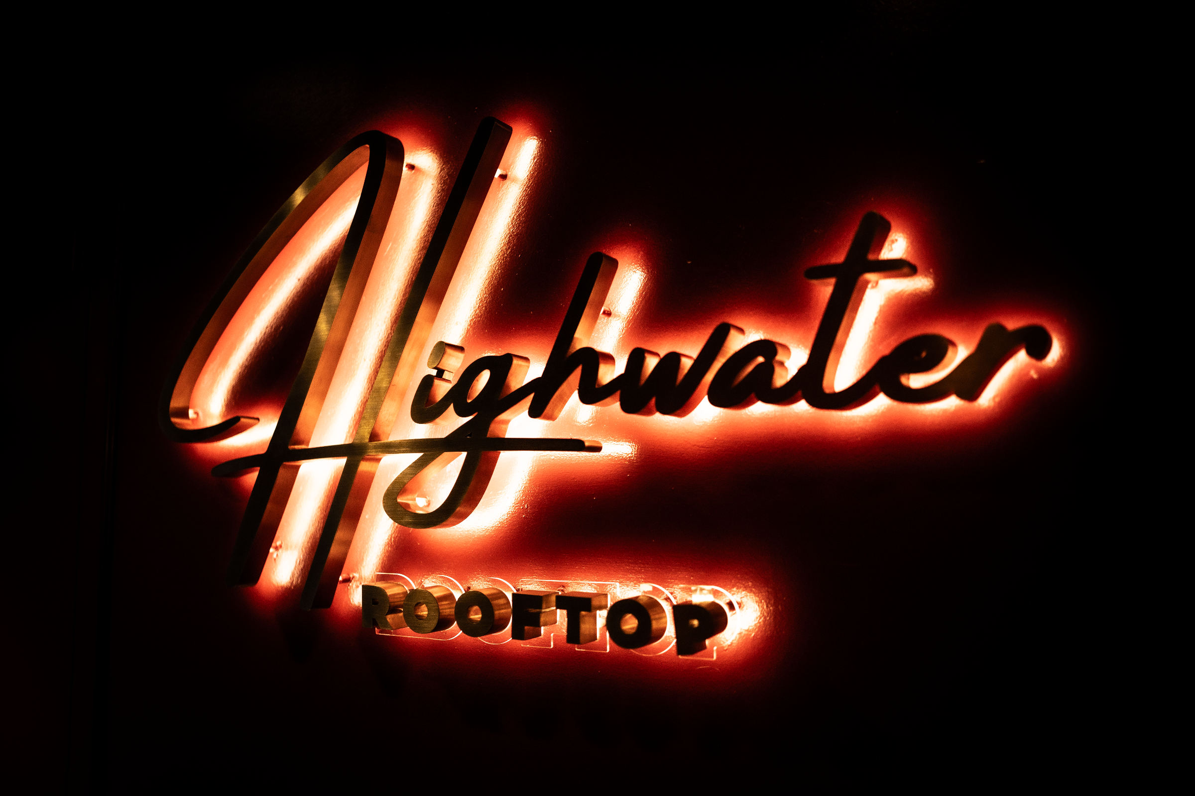 Highwater Rooftop neon sign in the Midnight Victorian Parlor
