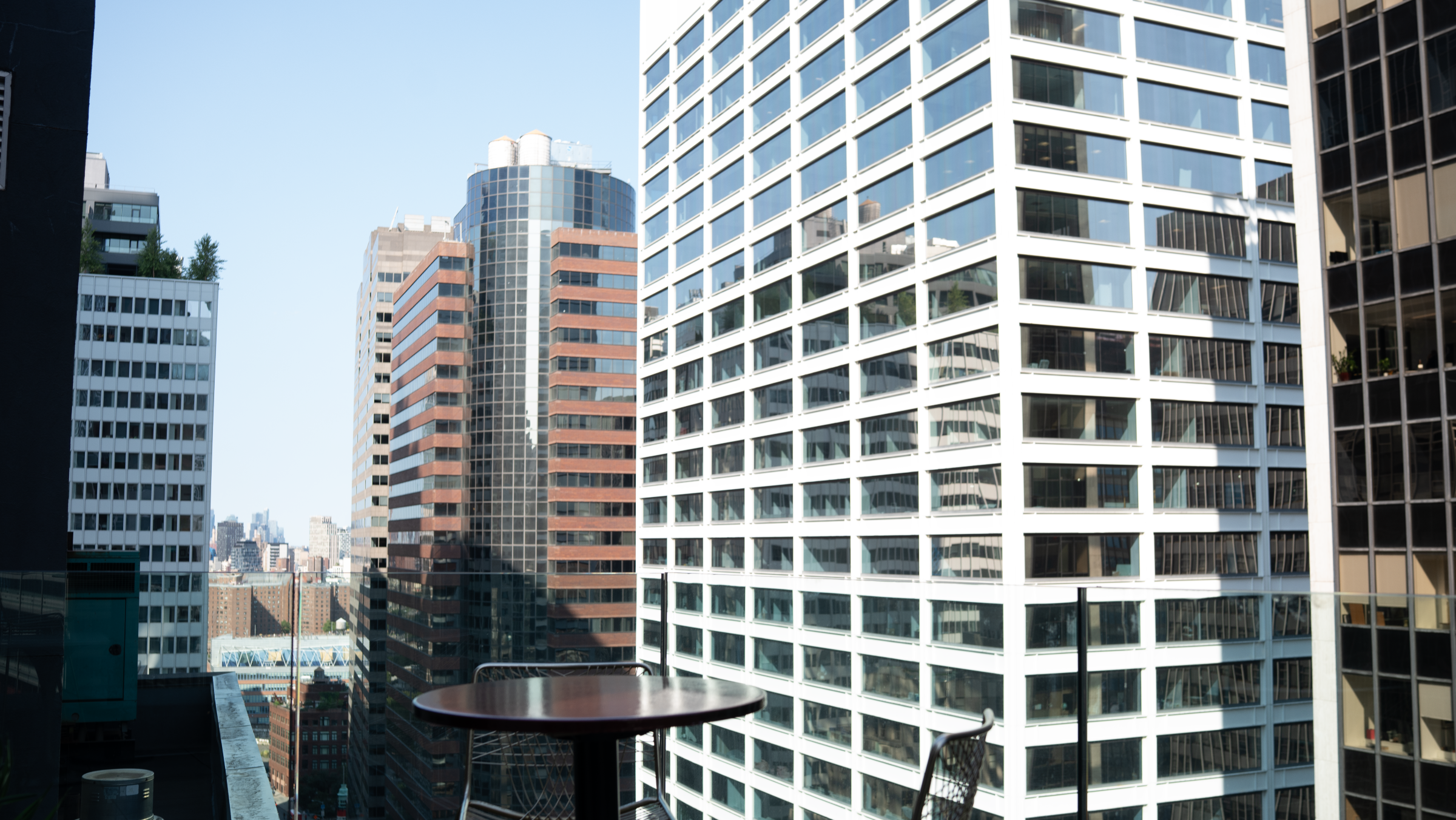 Terrace table and Lower Manhattan skyline view from Highwater Rooftop