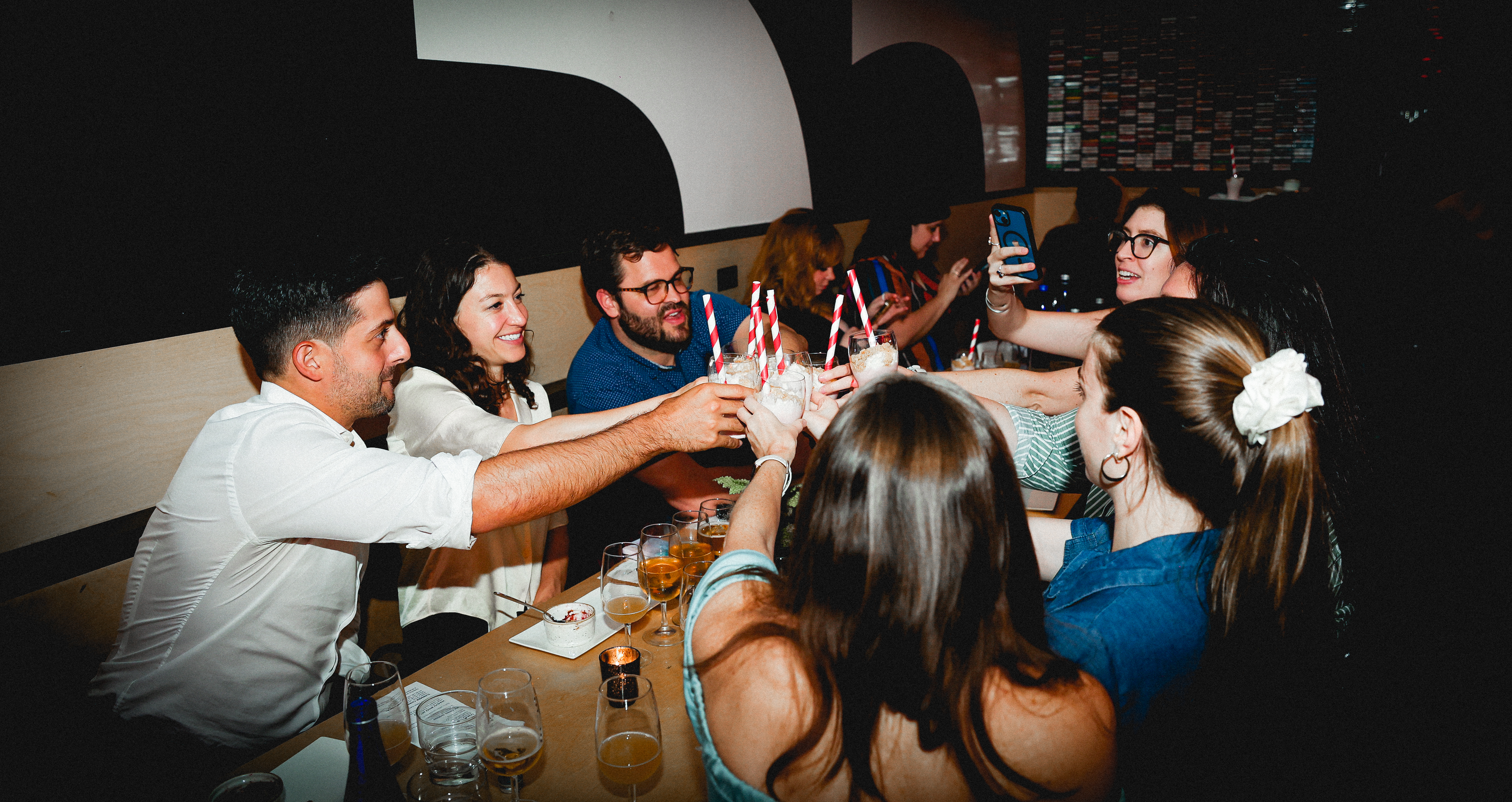 Private group celebration inside the Cassette Room event space at Black Tap.