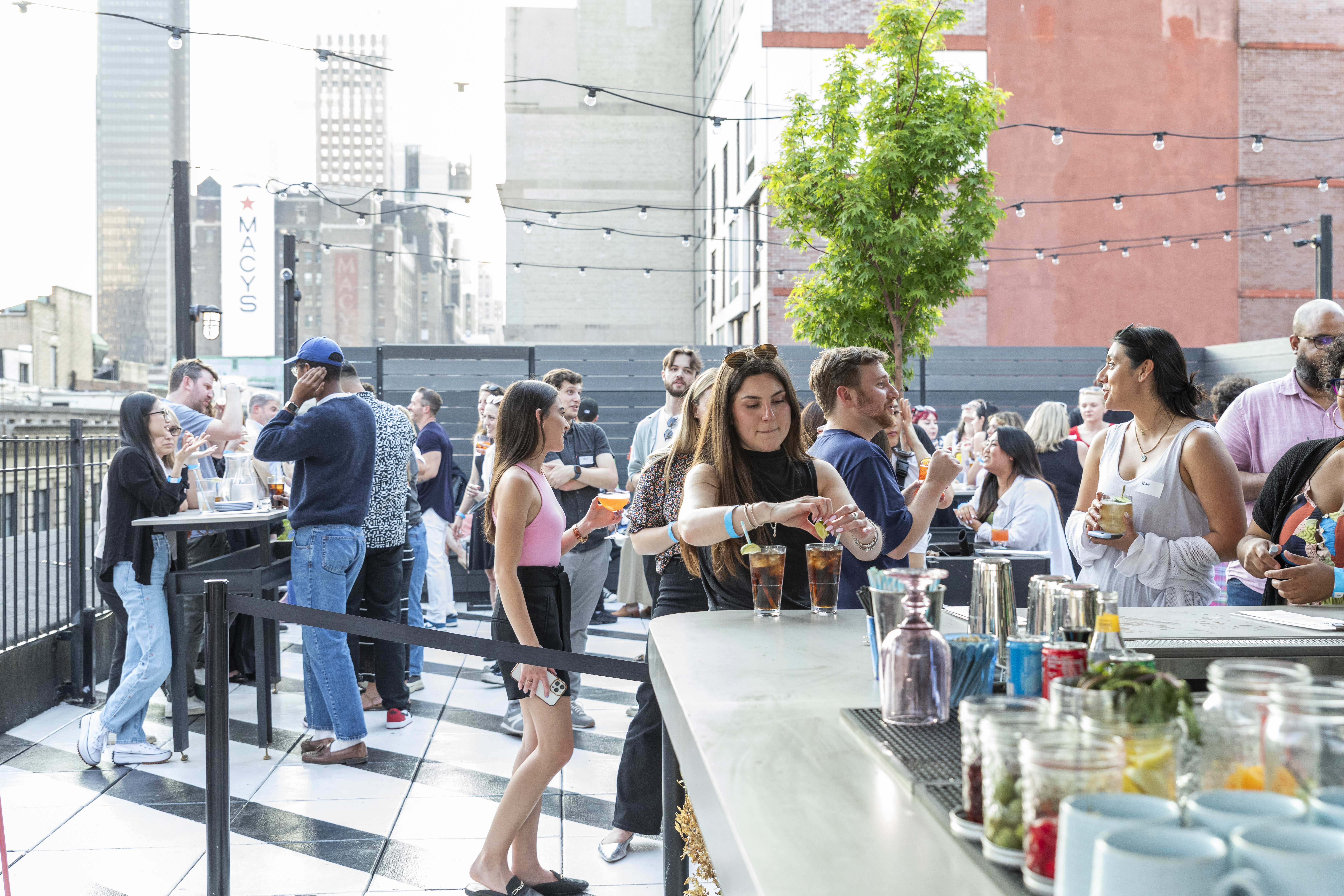 Cocktail bar service and social gathering at Lookup Rooftop event space.