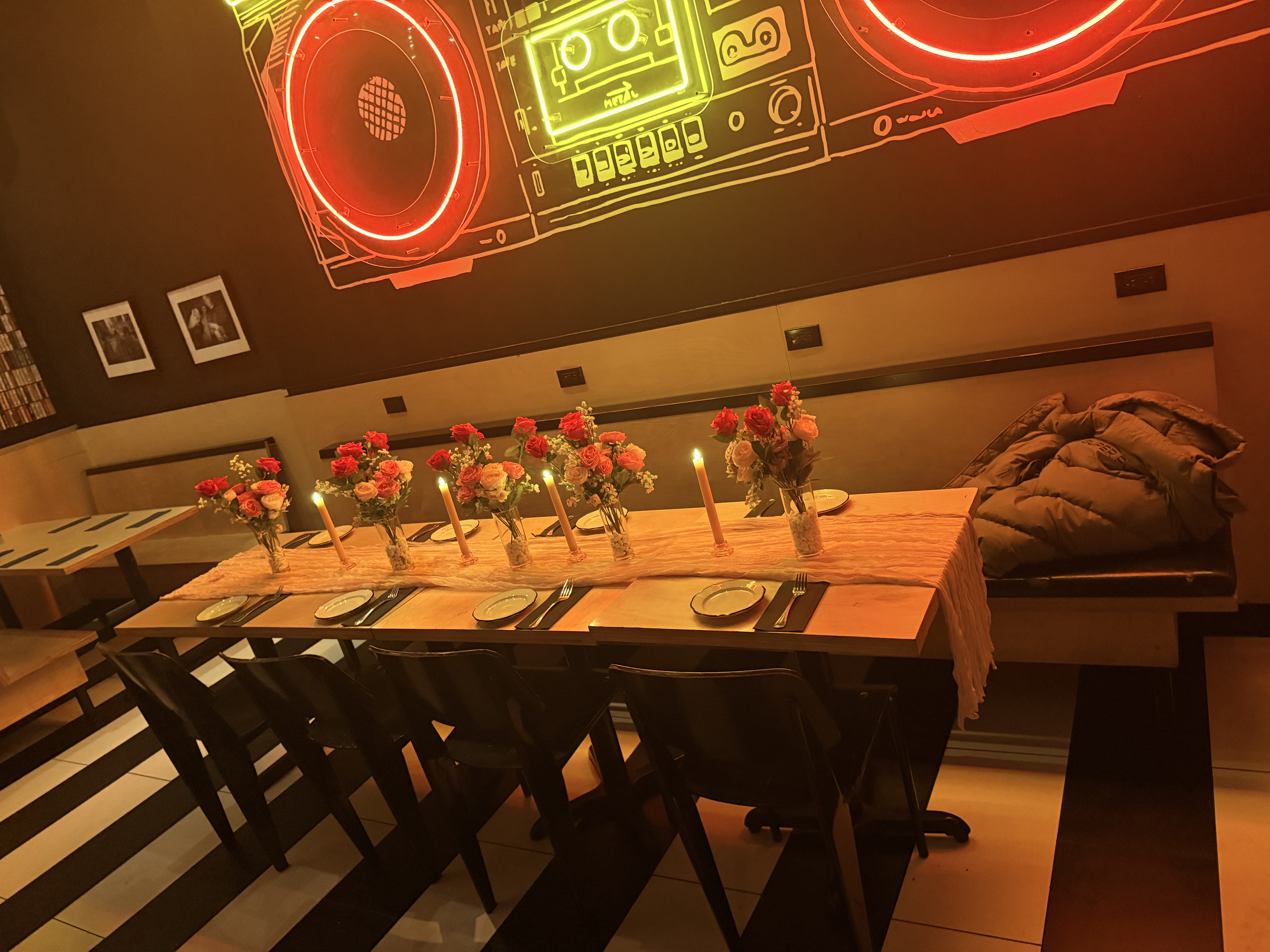 Private group dining table setup inside Black Tap event space for birthday or corporate dinners.