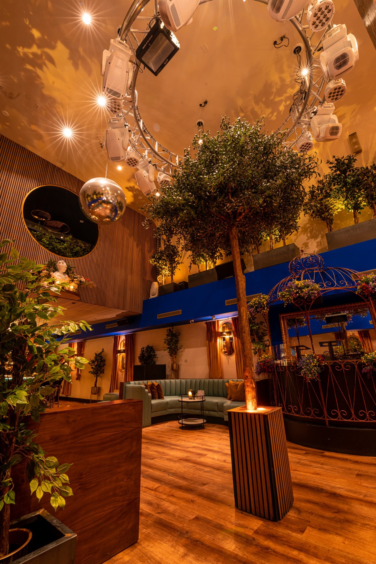 first floor lounge seating nightclub with garden and disco ball